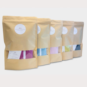 packaging of five merino swaddle pods in brown paper bags