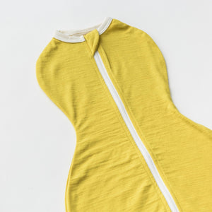 close up of merino zipper swaddle pod in yellow